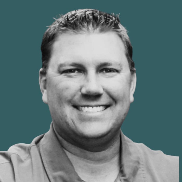 Indoor professional smiling man portrait at work.