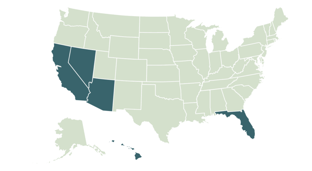 Image of a Big Green Egg ceramic outdoor grill on a patio.